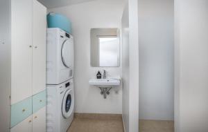 a white bathroom with a washing machine and a sink at Rab Barbat Villas 4 stars 300 sea in Barbat na Rabu +63 photos