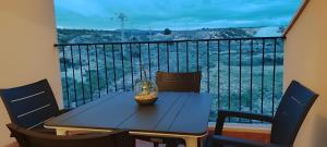 a table and chairs on a balcony with a view at Casa Altaona in Sucina