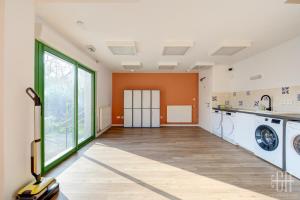 an empty laundry room with a washer and dryer at Terre - Proche A 10 - 2V - Parking in Saint-Pierre-des-Corps