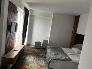 Postel nebo postele na pokoji v ubytování Hotel Sydney
