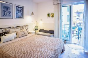 Кровать или кровати в номере Villa Mare Boutique Guesthouse by Flat Mаnаger