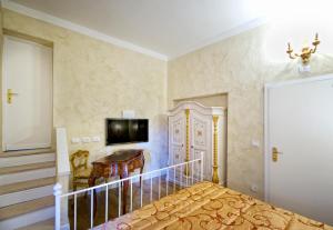 TV a/nebo společenská místnost v ubytování Boutique Hotel L'Imperatrice