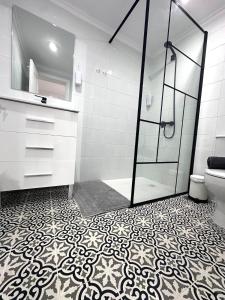 a bathroom with a shower and a toilet at El Rincón de Pancho in Guía de Isora +21 photos