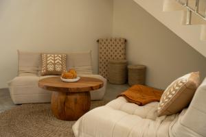 a living room with two couches and a coffee table at Villa Aura Lombok in Selong Belanak +25 photos