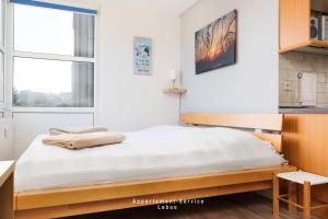 Ένα ή περισσότερα κρεβάτια σε δωμάτιο στο Ferienwohnung Conrad's Cove