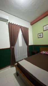 Letto o letti in una camera di ADA Homestay
