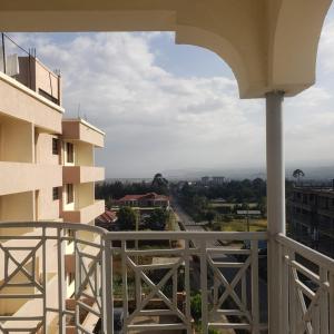 a balcony of a building with a view of a street at Kamemo la casa Homes in Nakuru