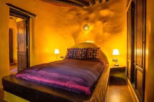 a bedroom with a large bed in a room at CONCHA - Sonnenbett, Sauna, traumhafter Meerblick, beheizter Pool, Billiard, Tischtennis in La Asomada +24 photos