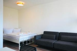a living room with a couch and a table at Apartment in ruhiger Lage-Waschmaschine-Balkon in Wolfsburg