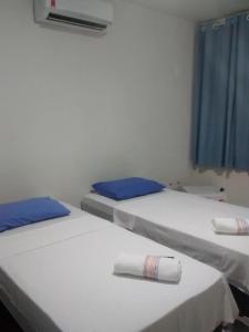 Postel nebo postele na pokoji v ubytování Iguassu fls