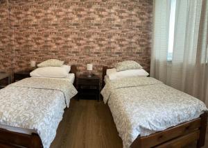 Posteľ alebo postele v izbe v ubytovaní Žižkov Cosy Studio Apartments