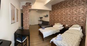 Posteľ alebo postele v izbe v ubytovaní Žižkov Cosy Studio Apartments