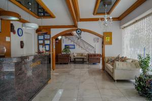 a lobby with couches and a staircase in a building at Sazak Hotel in Manavgat +49 photos