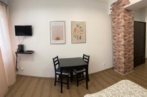 Televízia a/alebo spoločenská miestnosť v ubytovaní Žižkov Cosy Studio Apartments
