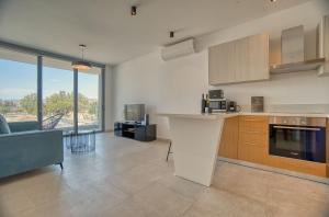 a kitchen with a counter top in a room at Avenue 202 1 BED in Paphos