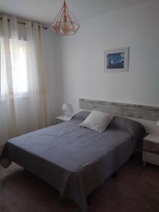 Postel nebo postele na pokoji v ubytování Boutique Algarrobo
