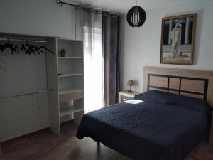 Postel nebo postele na pokoji v ubytování Boutique Algarrobo