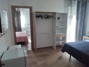 Postel nebo postele na pokoji v ubytování Boutique Algarrobo