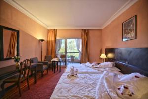 Postel nebo postele na pokoji v ubytování Hôtel Le Semiramis Marrakech by Bravia Hotels