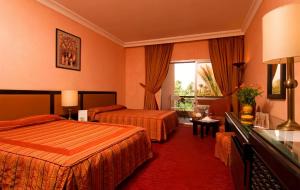 Postel nebo postele na pokoji v ubytování Hôtel Le Semiramis Marrakech by Bravia Hotels