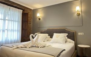 Posteľ alebo postele v izbe v ubytovaní Posada Spa San Marcos