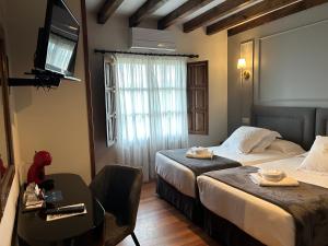 Posteľ alebo postele v izbe v ubytovaní Posada Spa San Marcos