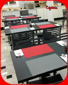 a group of tables and chairs in a kitchen at Hotel Albatros in Gandía