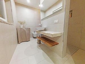 a bathroom with a sink and a toilet at La Dolce Lidia / Casa in Salento vicino al mare in Spongano