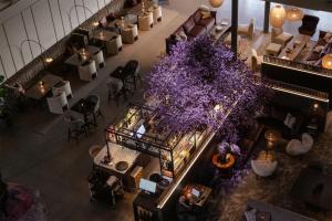an overhead view of a lobby with purple flowers at Sankt Jörgen Park in Gothenburg +56 photos