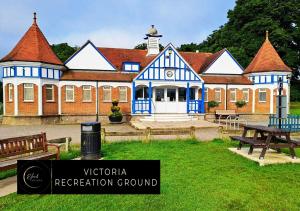 a building with a sign in front of it at Warm & Bright Studio, Easy Commute to Central in New Southgate