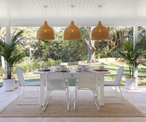 a white dining room with a white table and chairs at Luxury Montville getaway for up to 12 guests in Montville