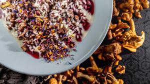 a white bowl filled with a bowl of food at Monaco Sport Hotel in Santo Stefano di Cadore