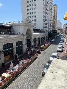 a street with cars parked in front of a building at ZenTelmo in Buenos Aires