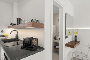 a kitchen with a sink and a stove at Dream of Paros in Parikia