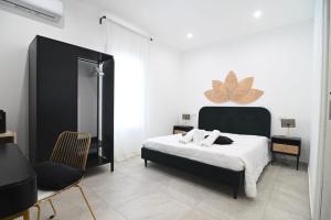 Postel nebo postele na pokoji v ubytování Residenze Miao