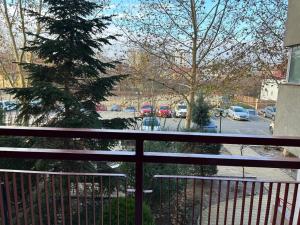 a balcony with a view of a parking lot at Best Value Studio Primavara, Free Parking in Bucharest