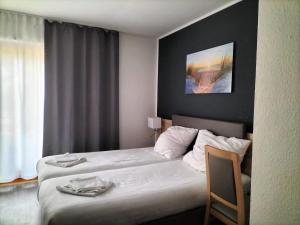 Postel nebo postele na pokoji v ubytování B3 Hotel