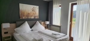Postel nebo postele na pokoji v ubytování B3 Hotel