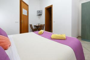Postel nebo postele na pokoji v ubytování Glicine room Sperlongaresort