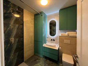 a bathroom with a sink and a glass shower at Apartment Nona Celina in Zadar