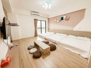 Uma cama ou camas num quarto em 澎湖樂在綺中民宿 第580號