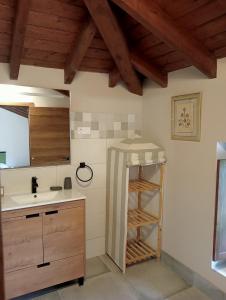 a kitchen with a sink and a counter with a shelf at Las Gallinas de María in San Miguel de Aras +47 photos