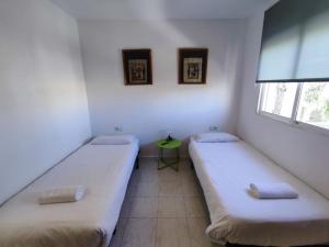 A bed or beds in a room at Townhouse with bbq and pools - Costa Hispania