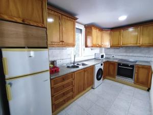 A kitchen or kitchenette at Townhouse with bbq and pools - Costa Hispania