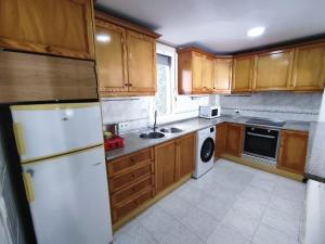 A kitchen or kitchenette at Townhouse with bbq and pools - Costa Hispania