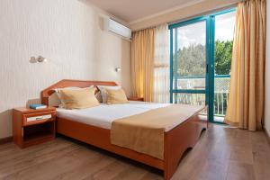 Postel nebo postele na pokoji v ubytování Zefir Hotel