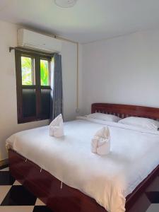 Ένα ή περισσότερα κρεβάτια σε δωμάτιο στο Khammany 康马尼