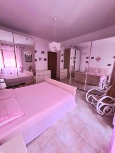 Postel nebo postele na pokoji v ubytování Casa vacanze zona mare + 7 fotografií
