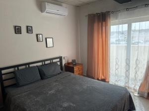Кровать или кровати в номере Cosy One-bedroom Penthouse