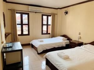 Ένα ή περισσότερα κρεβάτια σε δωμάτιο στο Khammany 康马尼 +6 φωτογραφίες